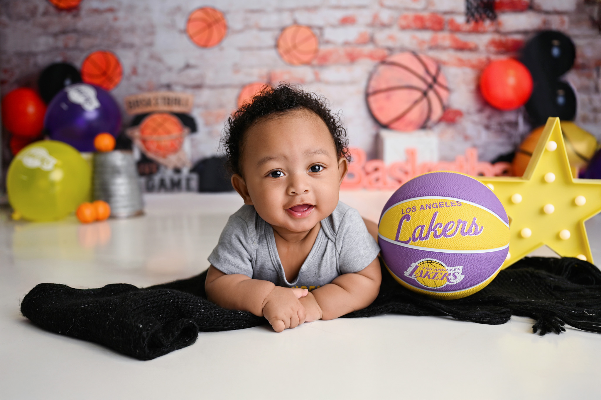 Baby smiling with a basketball