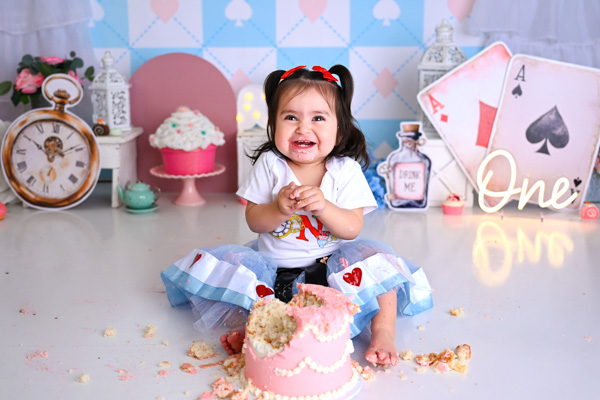 Toddler enjoying a cake smash moment