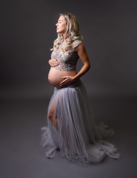 Pregnant woman smiling gently